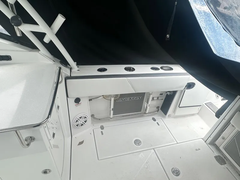 Slide: The Image of 2020 Blackfin 272 DC boat interior with seating and storage compartments. - 12