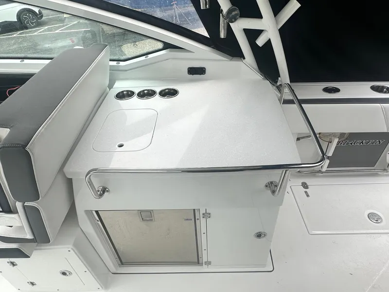 Slide: The Image of 2020 Blackfin 272 DC boat interior with seating and storage area. - 14