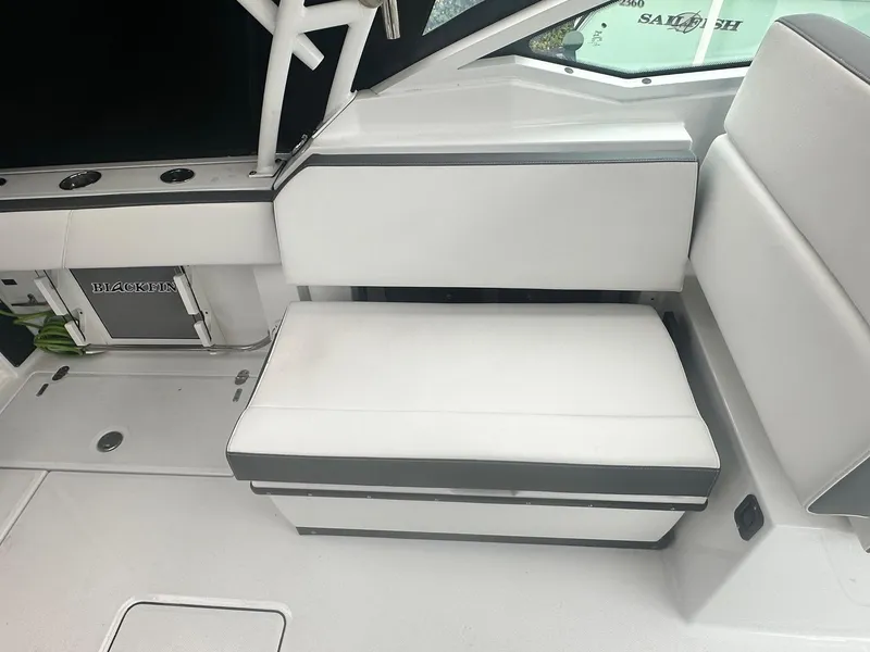 Slide: The Image of 2020 Blackfin 272 DC boat interior with white seating and sleek design. - 15
