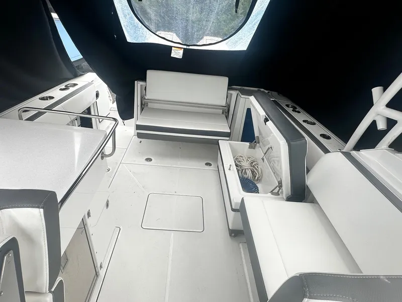 Slide: The Image of 2020 Blackfin 272 DC boat interior with seating and storage compartments. - 17
