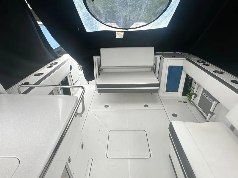 Slide: The Image of Interior of 2020 Blackfin 272 DC boat with white seating and modern design. - 18