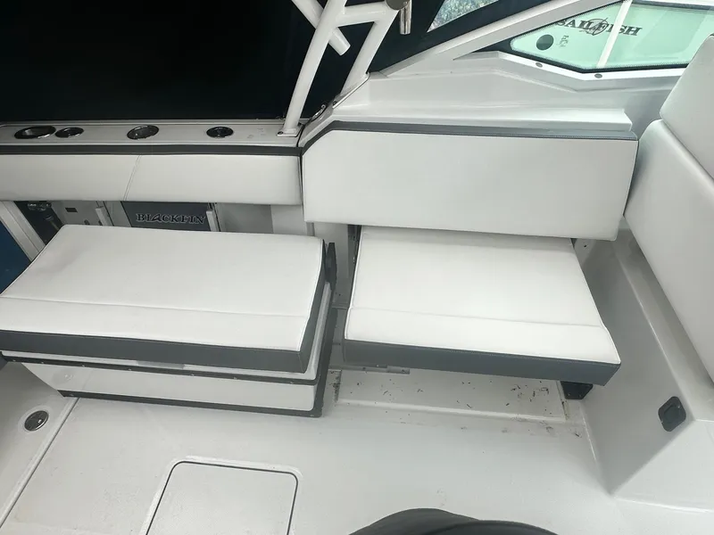 Slide: The Image of 2020 Blackfin 272 DC boat interior with white seating and sleek design. - 20