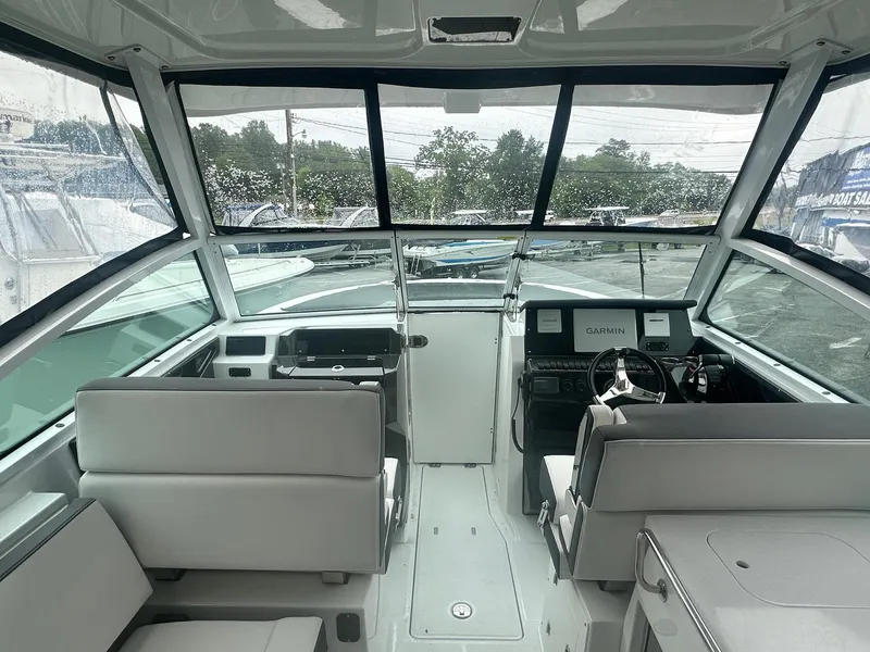 Slide: The Image of 2020 Blackfin 272 DC boat interior with modern helm and seating. - 22
