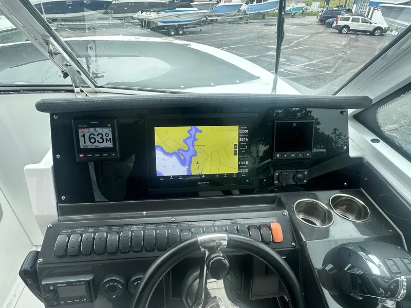 Slide: The Image of 2020 Blackfin 272 DC boat dashboard with navigation screens and controls. - 23