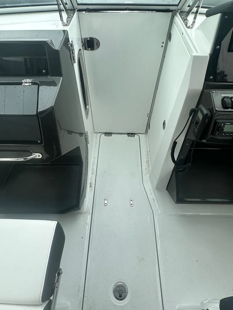 Slide: The Image of 2020 Blackfin 272 DC boat interior with seating and control panel. - 28