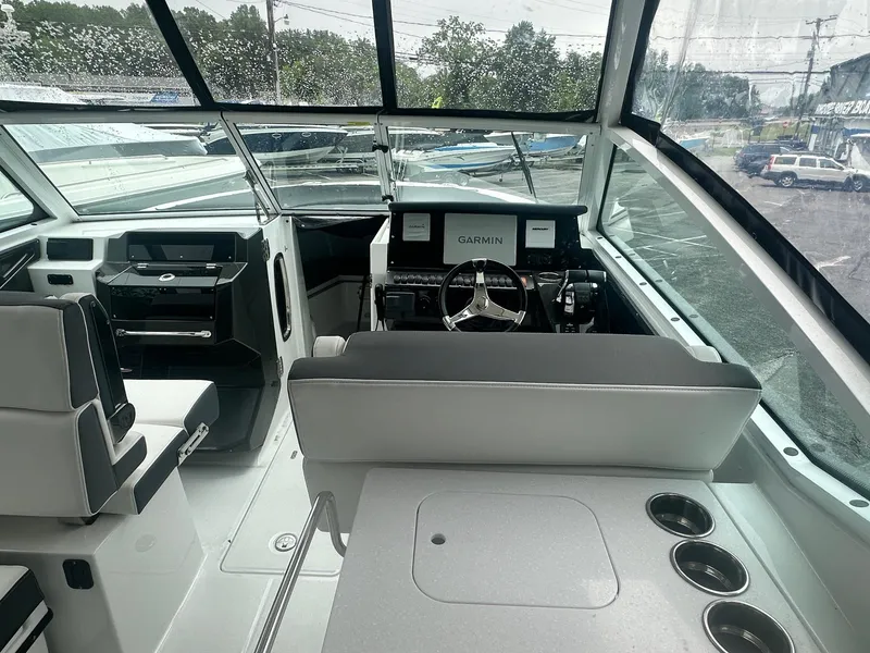 Slide: The Image of Interior view of 2020 Blackfin 272 DC boat with modern helm and seating. - 32