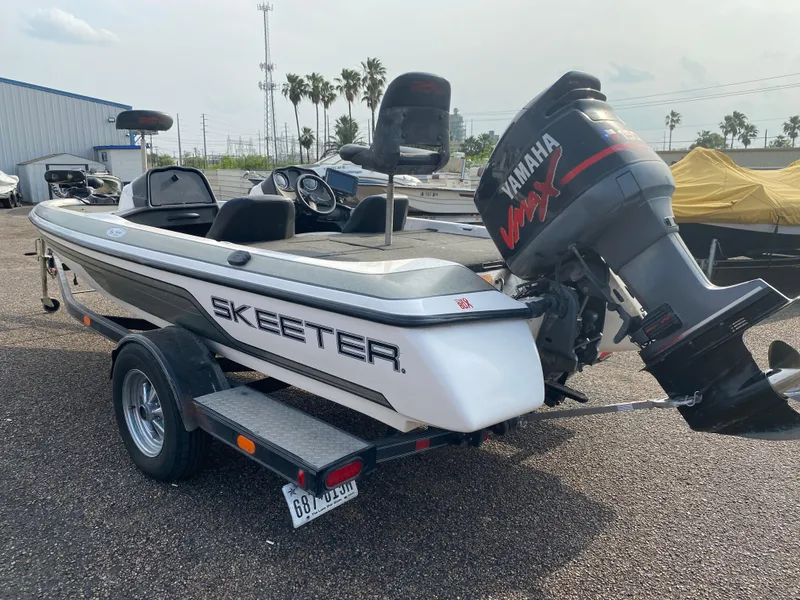 Slide: The Image of 2005 Skeeter SX190 boat with Yamaha VMAX engine on a trailer. - 4