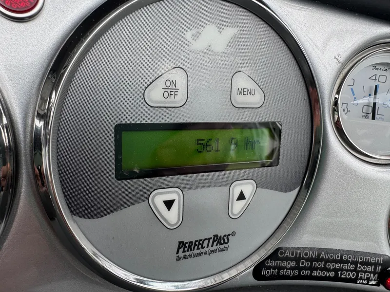 Slide: The Image of 2004 Correct Craft AIR NAUTIQUE SV 211 dashboard with PerfectPass speed control display. - 15