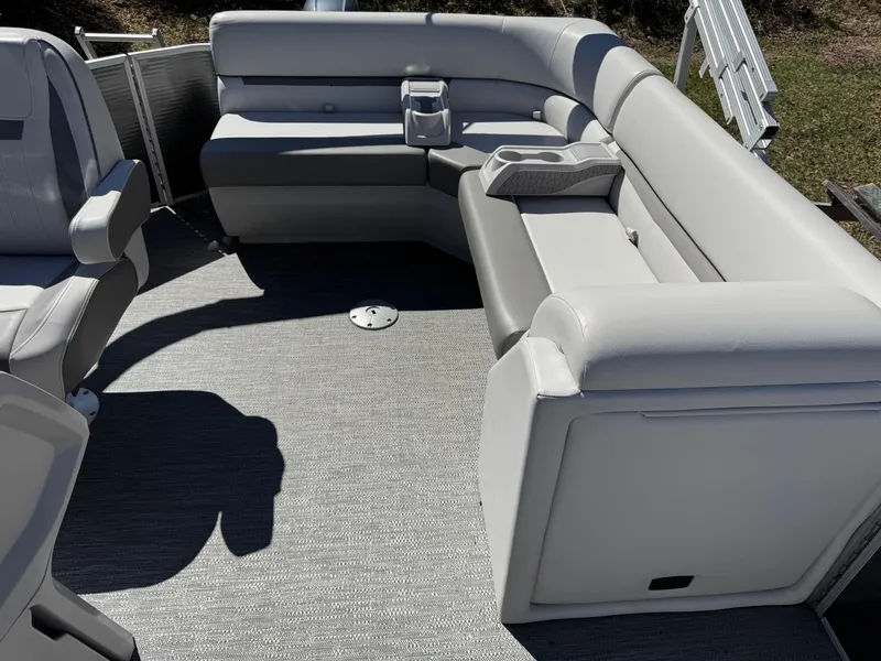 Slide: The Image of 2023 Godfrey Sweetwater 2086 C pontoon boat interior with gray seating and flooring. - 10