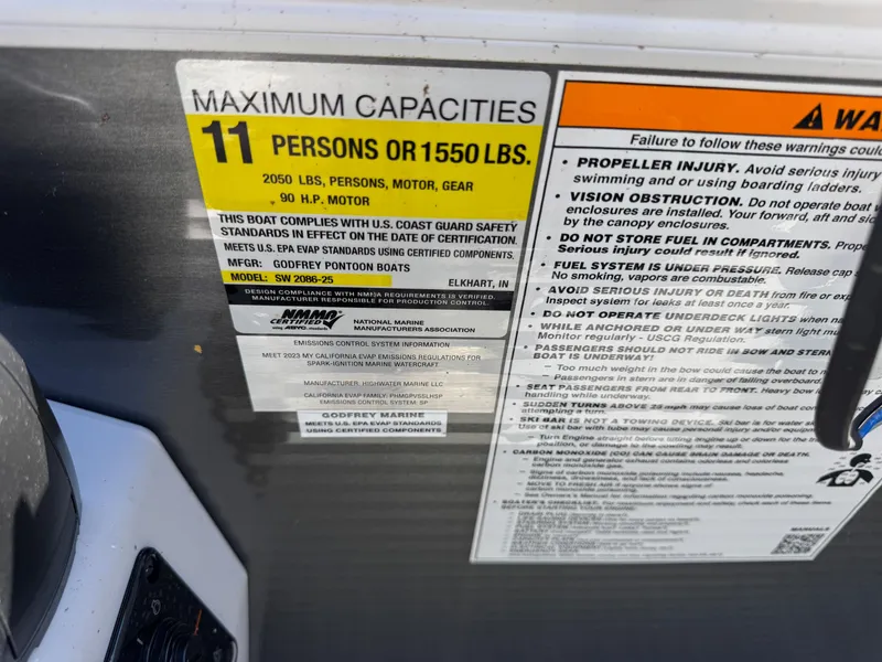 Slide: The Image of Capacity label on 2023 Godfrey Sweetwater 2086 C boat, max 11 persons or 1550 lbs. - 12
