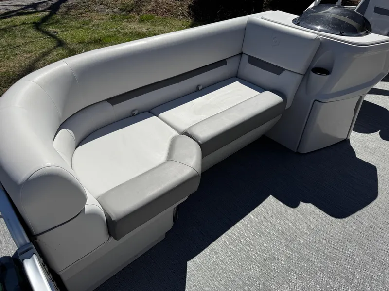 Slide: The Image of Luxurious seating on 2023 Godfrey Sweetwater 2086 C pontoon boat, featuring plush gray upholstery. - 8