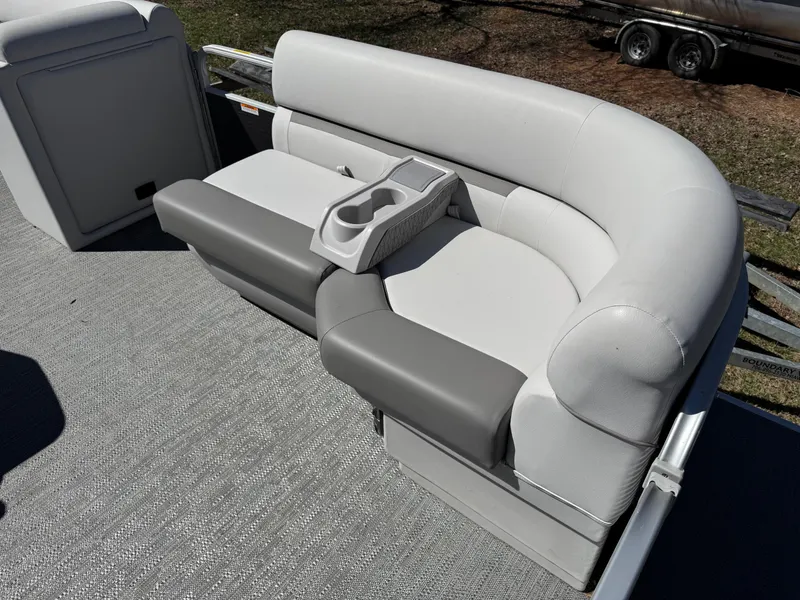 Slide: The Image of 2023 Godfrey Sweetwater 2086 C boat seating with cup holders, featuring gray and white upholstery. - 9