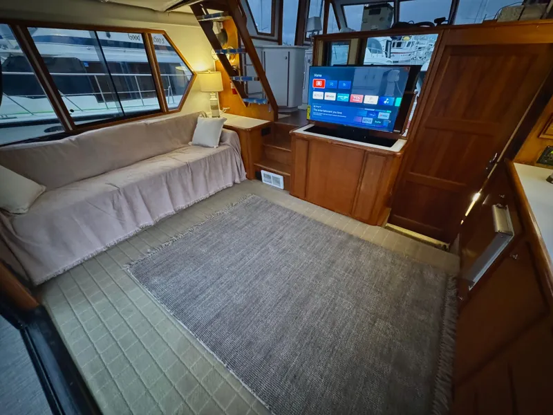 Slide: The Image of Luxurious interior of 1993 Navigator 5000 Classic yacht with sofa, TV, and elegant decor. - 10