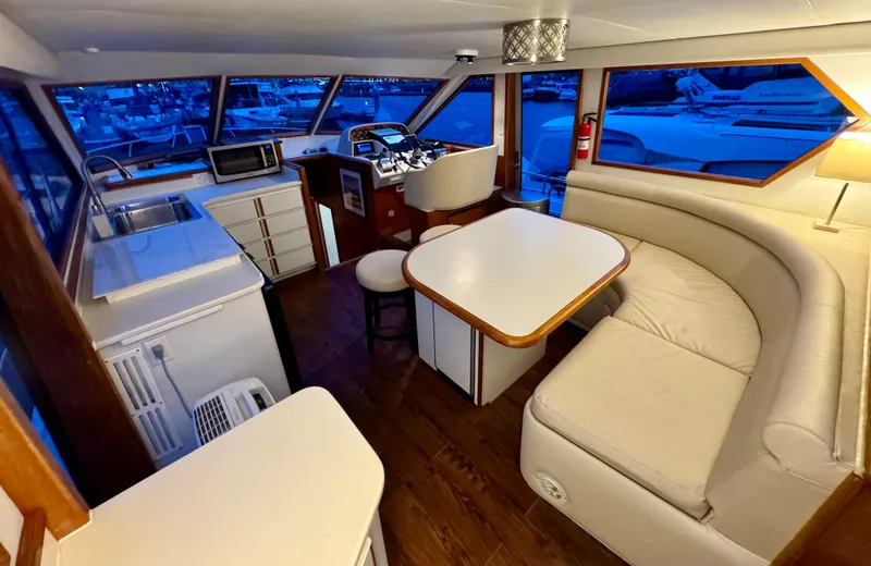Slide: The Image of Interior of 1993 Navigator 5000 Classic yacht with kitchen and seating area. - 11