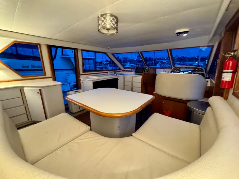 Slide: The Image of Interior of 1993 Navigator 5000 Classic yacht with dining area and panoramic windows. - 14