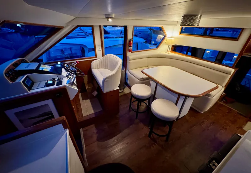 Slide: The Image of Interior of 1993 Navigator 5000 Classic yacht with seating and helm station. - 15