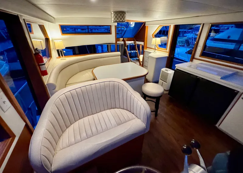 Slide: The Image of Interior of 1993 Navigator 5000 Classic yacht with elegant seating and dining area. - 19
