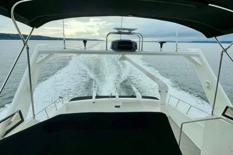 Slide: The Image of Navigator 5000 Classic yacht cruising on open water, 1993 model, rear view. - 2