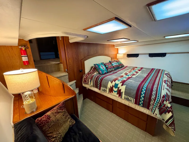 Slide: The Image of Luxurious bedroom interior of 1993 Navigator 5000 Classic yacht with cozy bedding. - 21