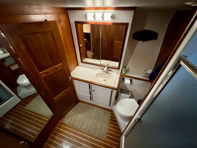 Slide: The Image of Luxurious 1993 Navigator 5000 Classic yacht bathroom with wood accents and modern fixtures. - 23