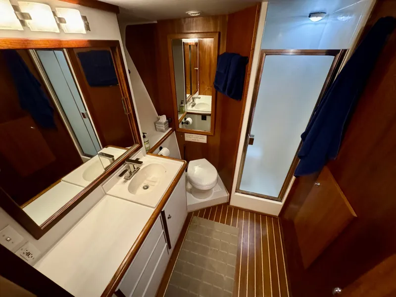 Slide: The Image of Bathroom interior of 1993 Navigator 5000 Classic yacht with wood accents and modern fixtures. - 24