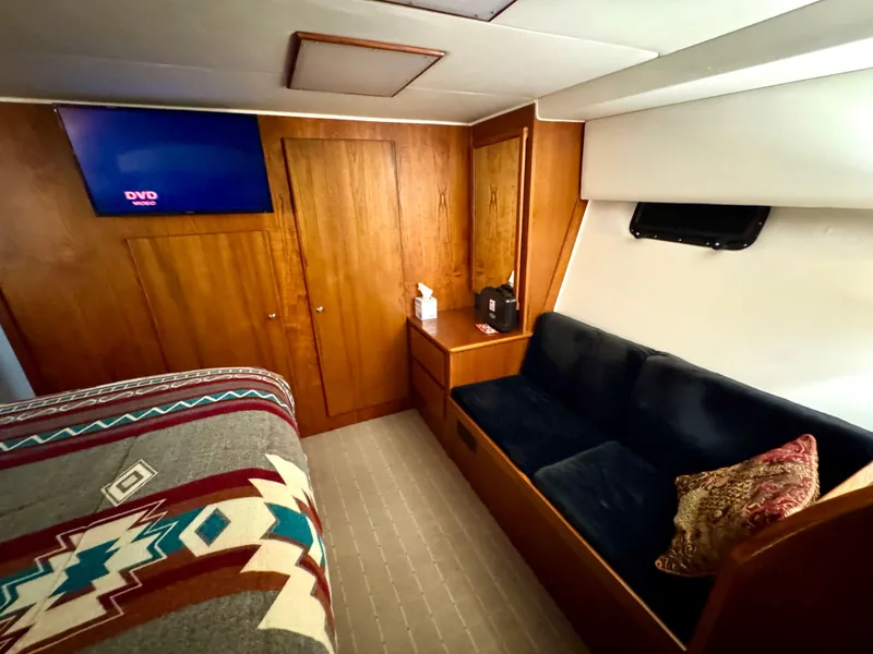 Slide: The Image of Cozy cabin interior of 1993 Navigator 5000 Classic yacht with wood paneling and modern amenities. - 26