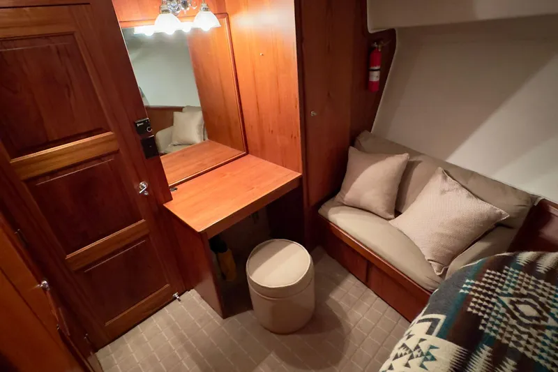 Slide: The Image of Cozy cabin interior of 1993 Navigator 5000 Classic with wooden decor and seating area. - 28