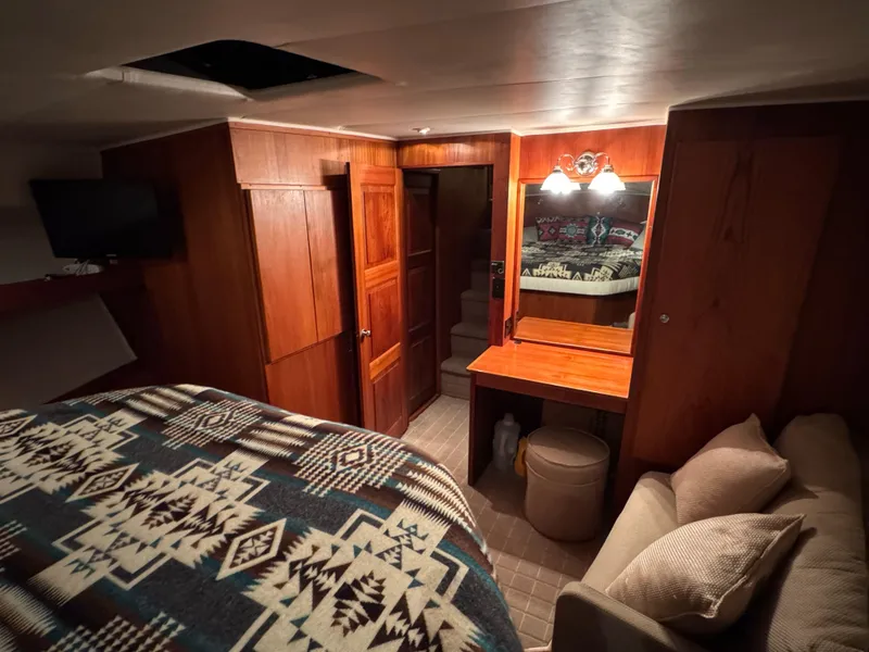 Slide: The Image of Cozy interior of 1993 Navigator 5000 Classic with wood paneling and patterned bedding. - 29