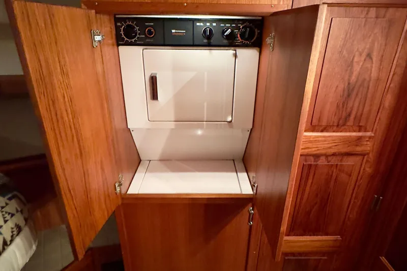 Slide: The Image of 1993 Navigator 5000 Classic interior with built-in laundry appliance in wooden cabinet. - 30