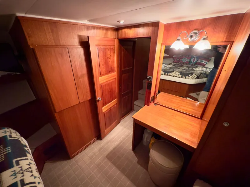 Slide: The Image of Interior of 1993 Navigator 5000 Classic yacht with wooden cabinetry and vanity area. - 31