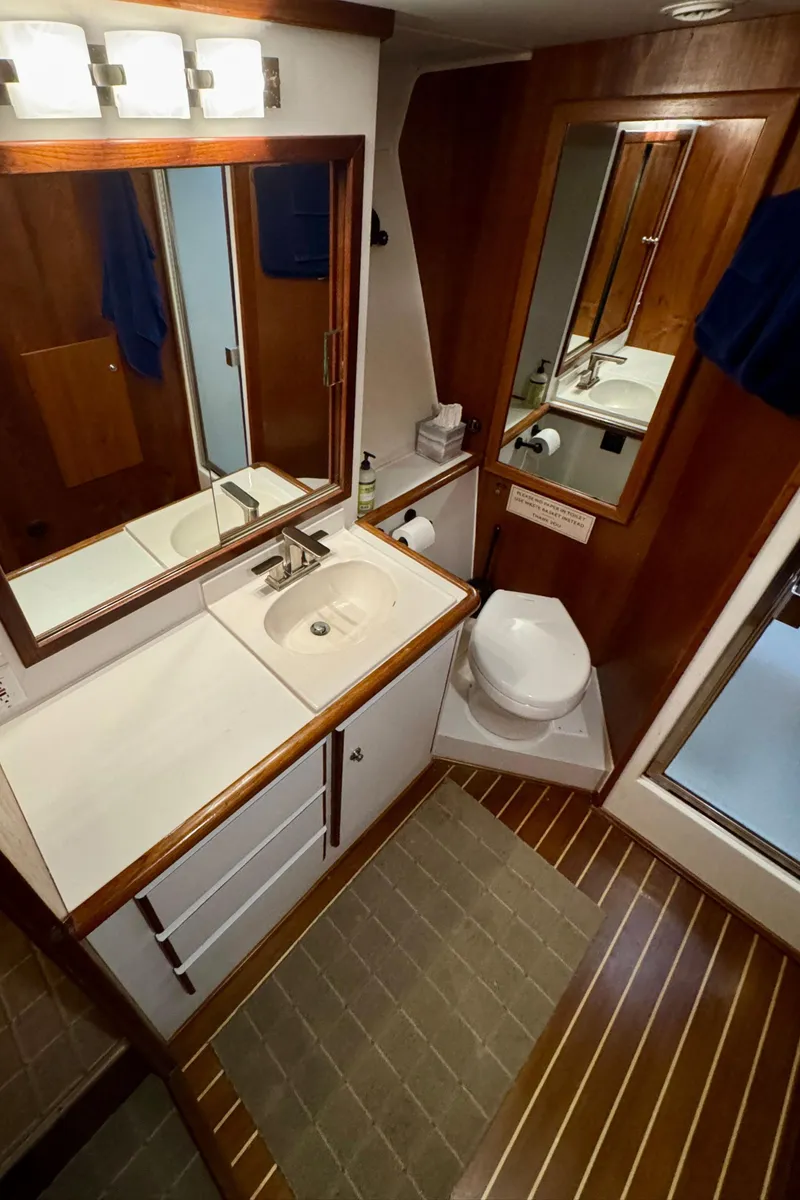 Slide: The Image of Bathroom interior of 1993 Navigator 5000 Classic yacht with wood accents and modern fixtures. - 33