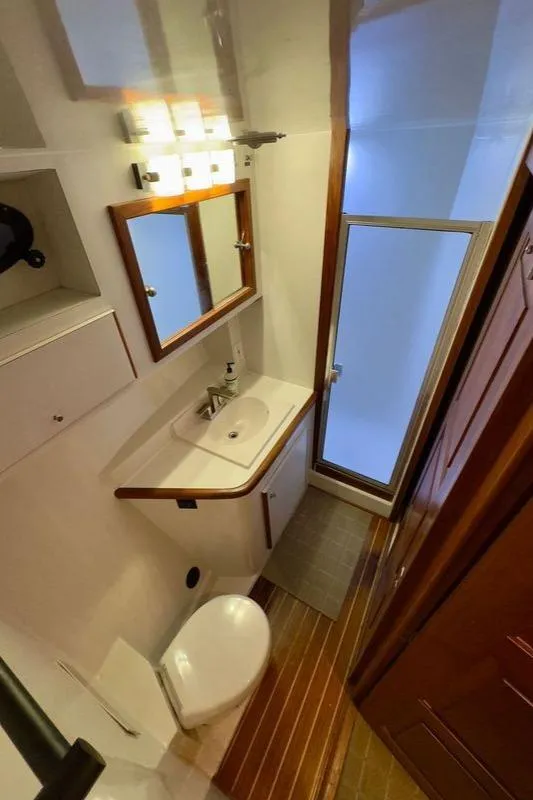 Slide: The Image of Bathroom interior of 1993 Navigator 5000 Classic yacht with sink, toilet, and mirror. - 35
