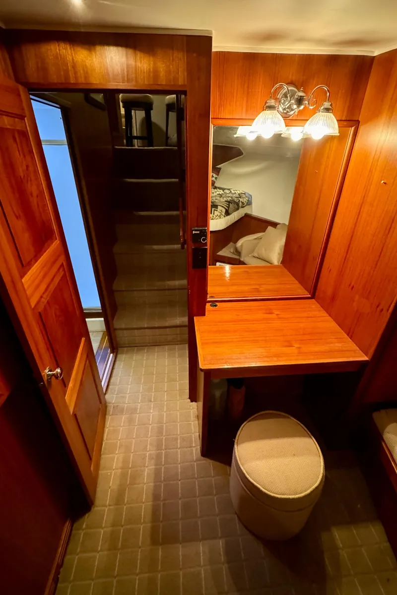 Slide: The Image of Interior of 1993 Navigator 5000 Classic yacht with wooden furnishings and vanity area. - 36