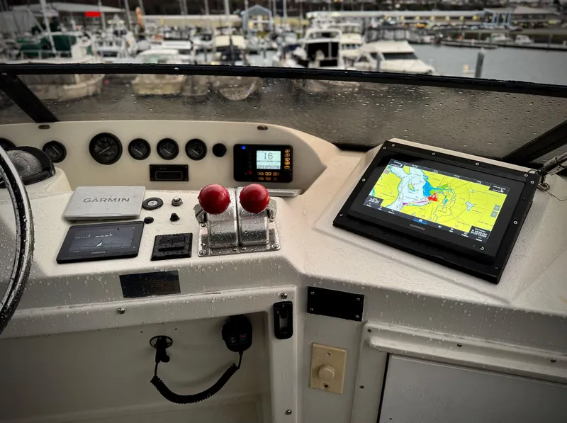 Slide: The Image of Control panel of a 1993 Navigator 5000 Classic boat with navigation equipment. - 40