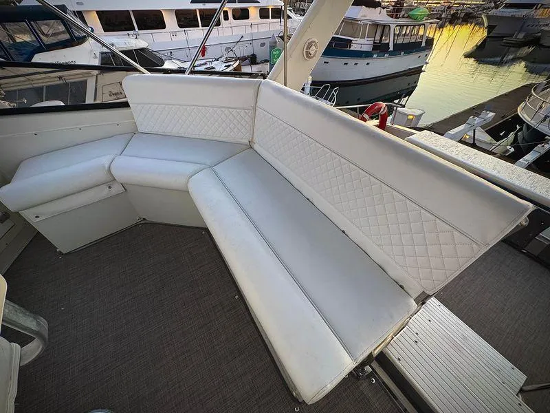 Slide: The Image of White leather seating on 1993 Navigator 5000 Classic yacht, docked at marina. - 45