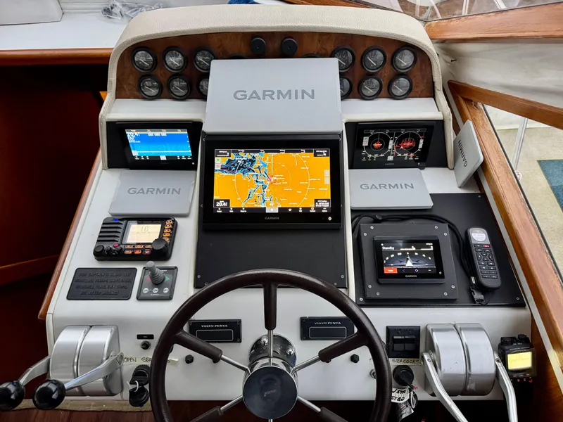 Slide: The Image of Navigator 5000 Classic 1993 helm with Garmin navigation system and control panel. - 46