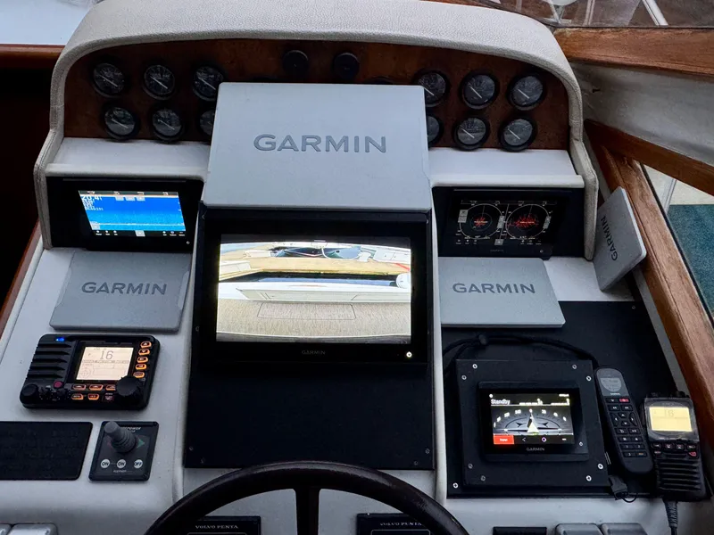 Slide: The Image of Navigator 5000 Classic 1993 boat dashboard with Garmin navigation and control systems. - 47