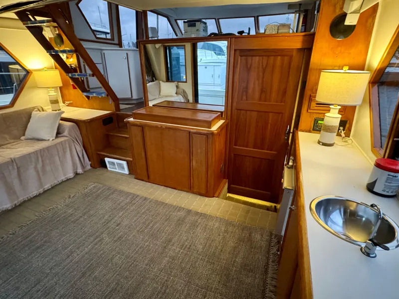 Slide: The Image of Interior of 1993 Navigator 5000 Classic yacht with wood finishes and cozy seating area. - 8
