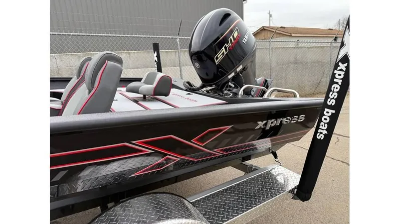 Slide: The Image of 2025 Xpress H18 boat with Yamaha engine, featuring sleek design and modern seating. - 11