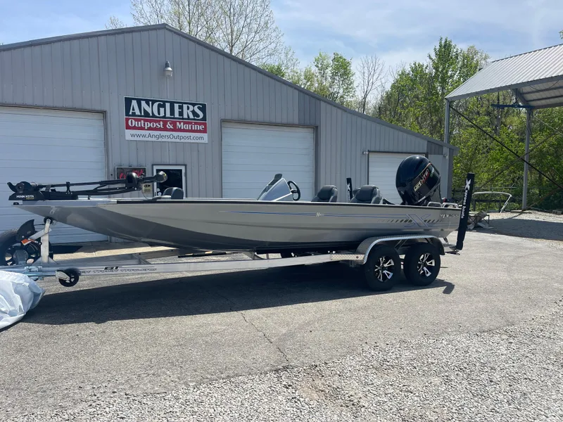 Slide: The Image of 2025 Xpress H20 boat on trailer at Anglers Outpost & Marine dealership. - 3