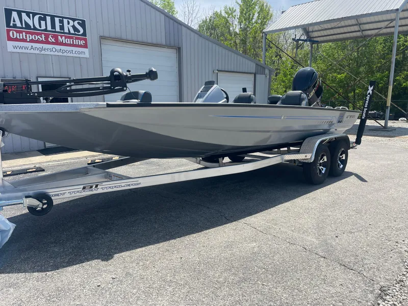 Slide: The Image of 2025 Xpress H20 boat on trailer at Anglers Outpost & Marine dealership. - 4