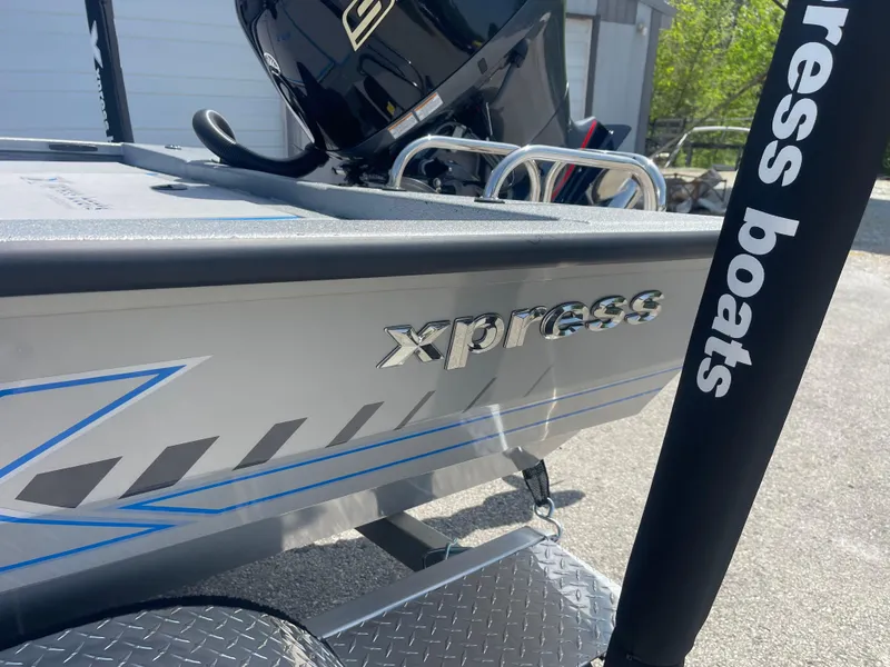 Slide: The Image of 2025 Xpress H20 boat with sleek design and branding, featuring a powerful engine. - 5