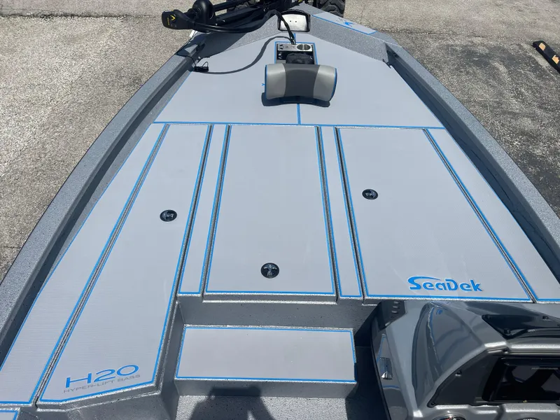Slide: The Image of 2025 Xpress H20 boat deck with SeaDek flooring, featuring sleek design and modern equipment. - 7