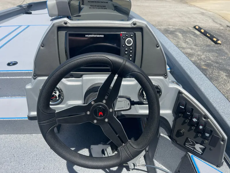 Slide: The Image of Steering console of 2025 Xpress H20 boat with navigation controls and display. - 8