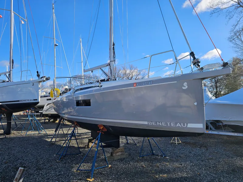 Slide: The Image of Beneteau Oceanis 30.1 sailboat, 2022 model, displayed on stands in a boatyard. - 5