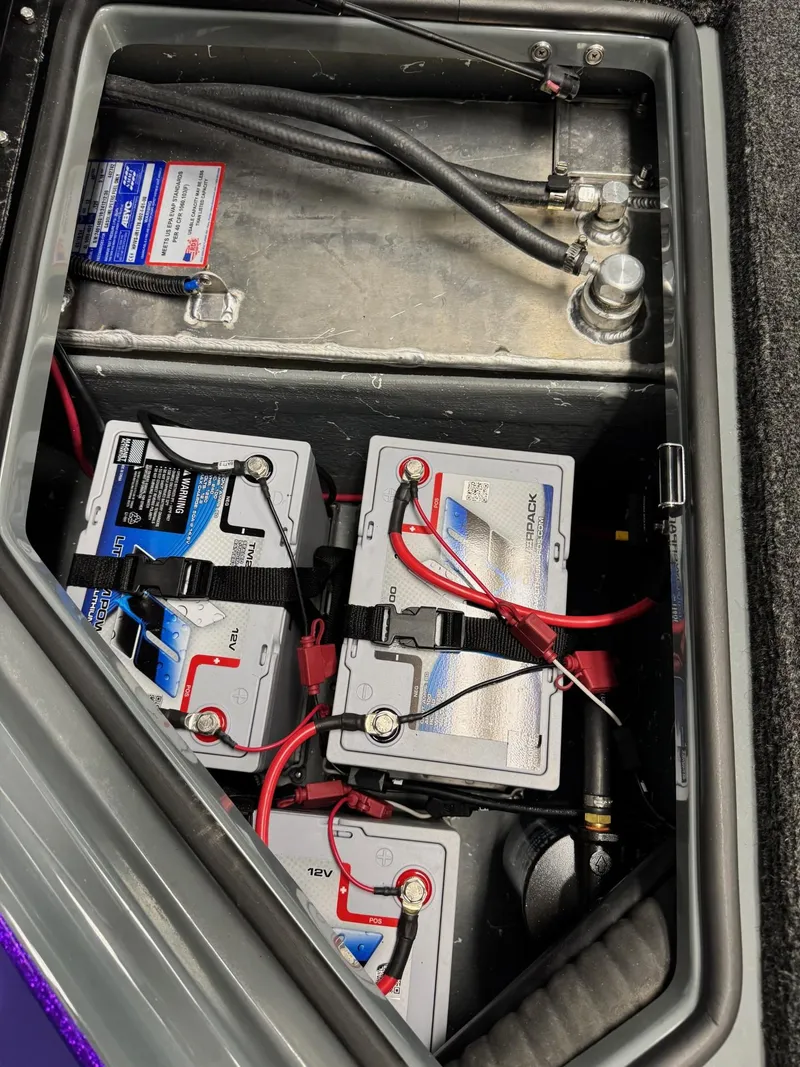 Slide: The Image of Battery compartment of a 2025 Bullet 21XST boat with wiring and connections. - 8