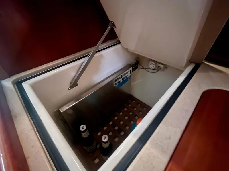 Slide: The Image of 2005 Hinckley Picnic Boat EP interior cooler with beverages inside. - 18