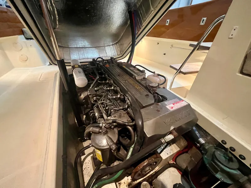 Slide: The Image of Engine compartment of a 2005 Hinckley Picnic Boat EP, showcasing detailed mechanical components. - 21