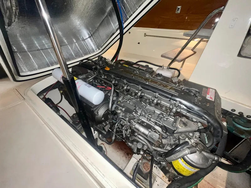 Slide: The Image of Engine compartment of a 2005 Hinckley Picnic Boat EP, showcasing detailed mechanical components. - 22