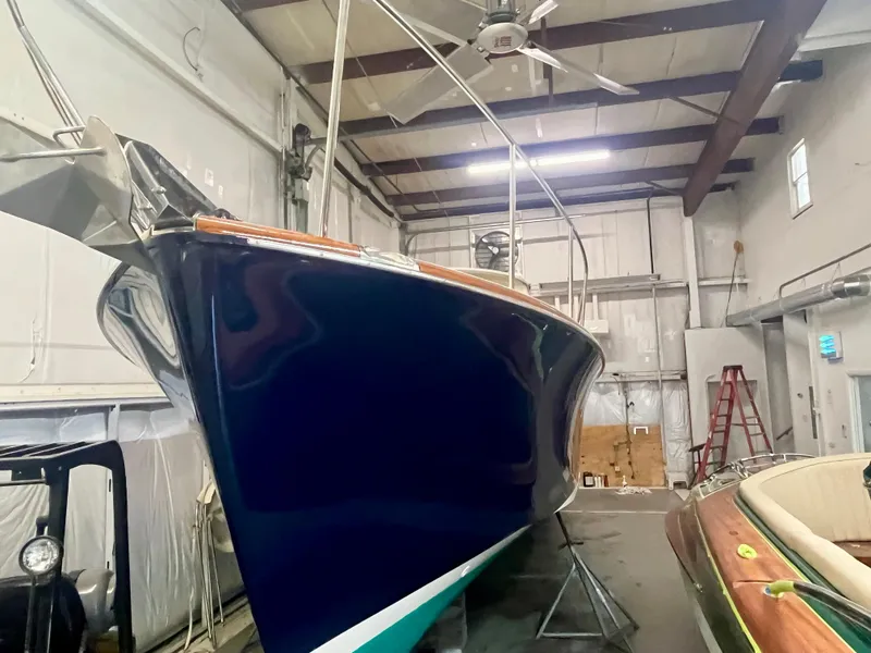 Slide: The Image of 2005 Hinckley Picnic Boat EP in storage, showcasing sleek design and craftsmanship. - 27